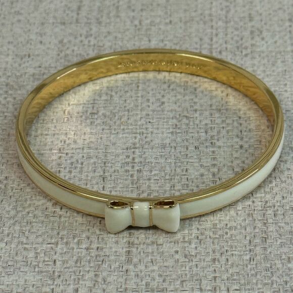 Kate Spade Cream & Gold Enamel Take A Bow Bangle Bracelet - Picture 2 of 4